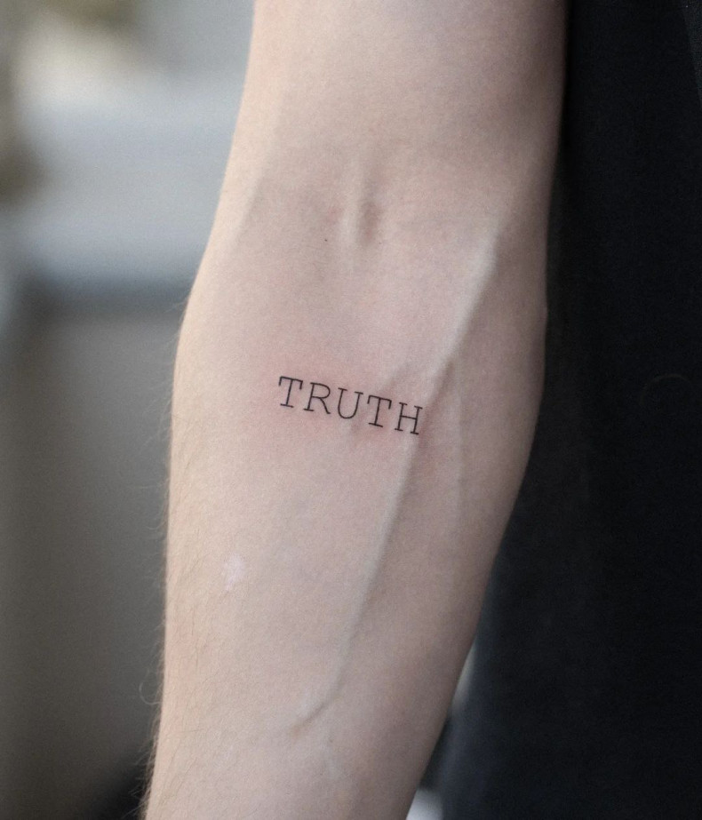 Men arm letter, photo - Tattoo Studio Gorilla