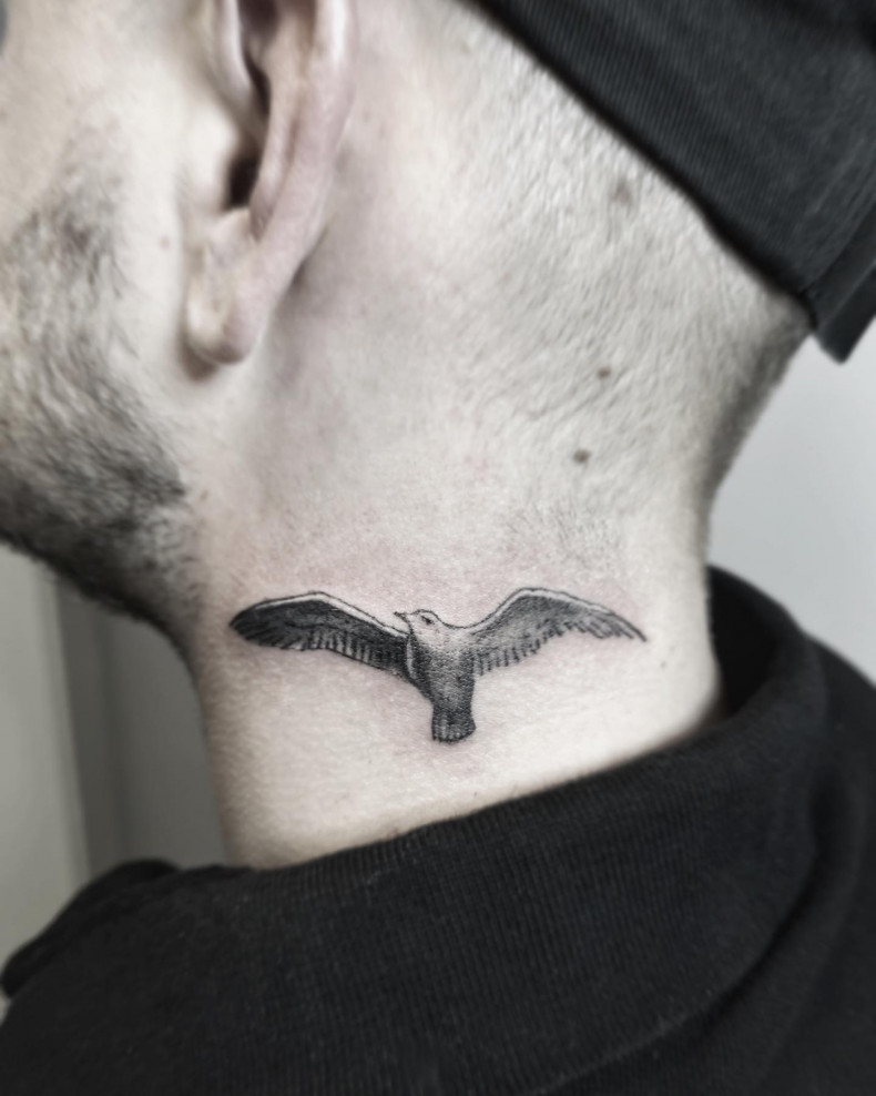 Men neck bird, photo - Tattoo Master Kirgotattoo