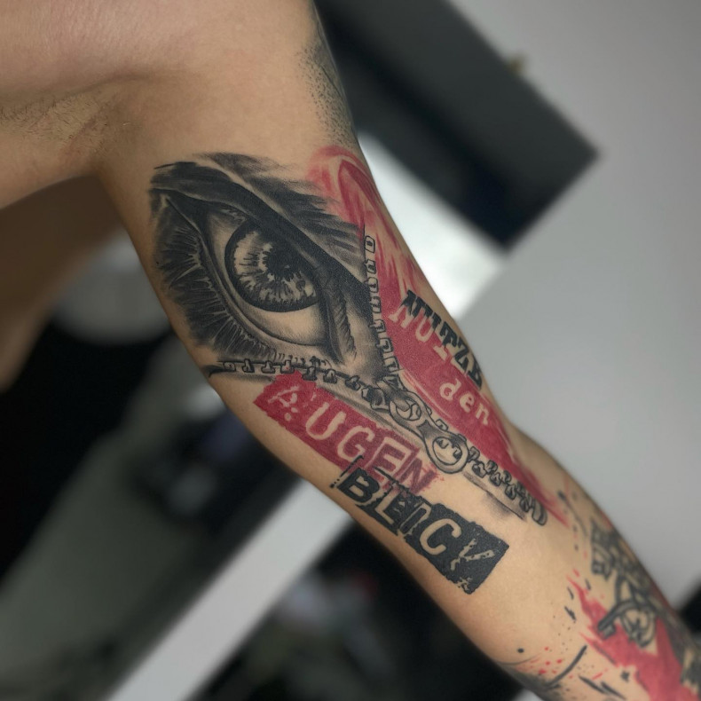 Men eye arm, photo - Tattoo Master Molly tattoo