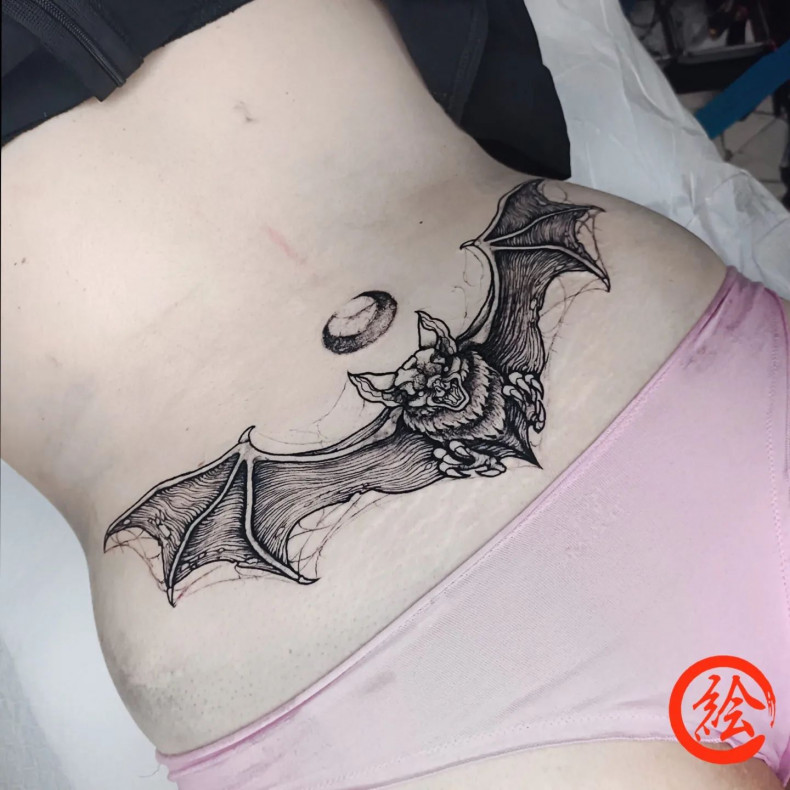 Women bat lower back, photo - Tattoo Studio Mad Monkey Tattoo