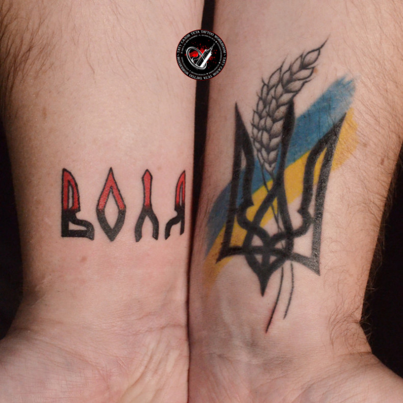 Men emblem of Ukraine ear, photo - Tattoo Master Barb Tattoo