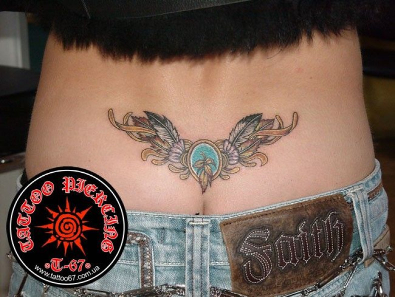 Women wings lower back, photo - Tattoo Master Barb Tattoo