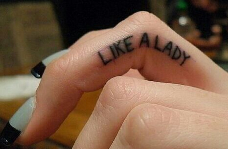 Women finger letter, photo - Tattoo Master Barb Tattoo