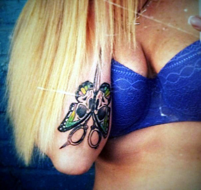 Women butterfly linework, photo - Tattoo Master Barb Tattoo