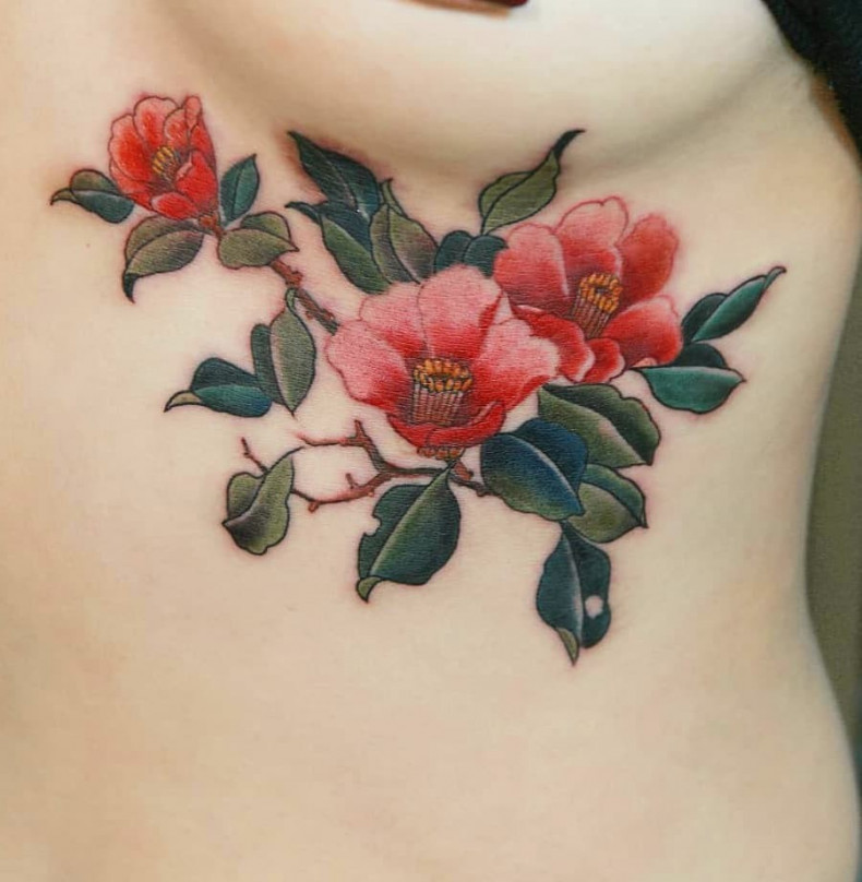 Women camellia under breast, photo - Tattoo Master Barb Tattoo