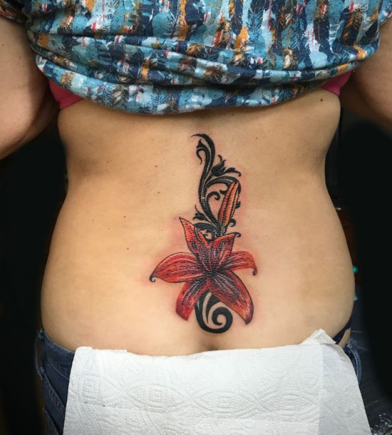 Women lily lower back, photo - Tattoo Master Barb Tattoo