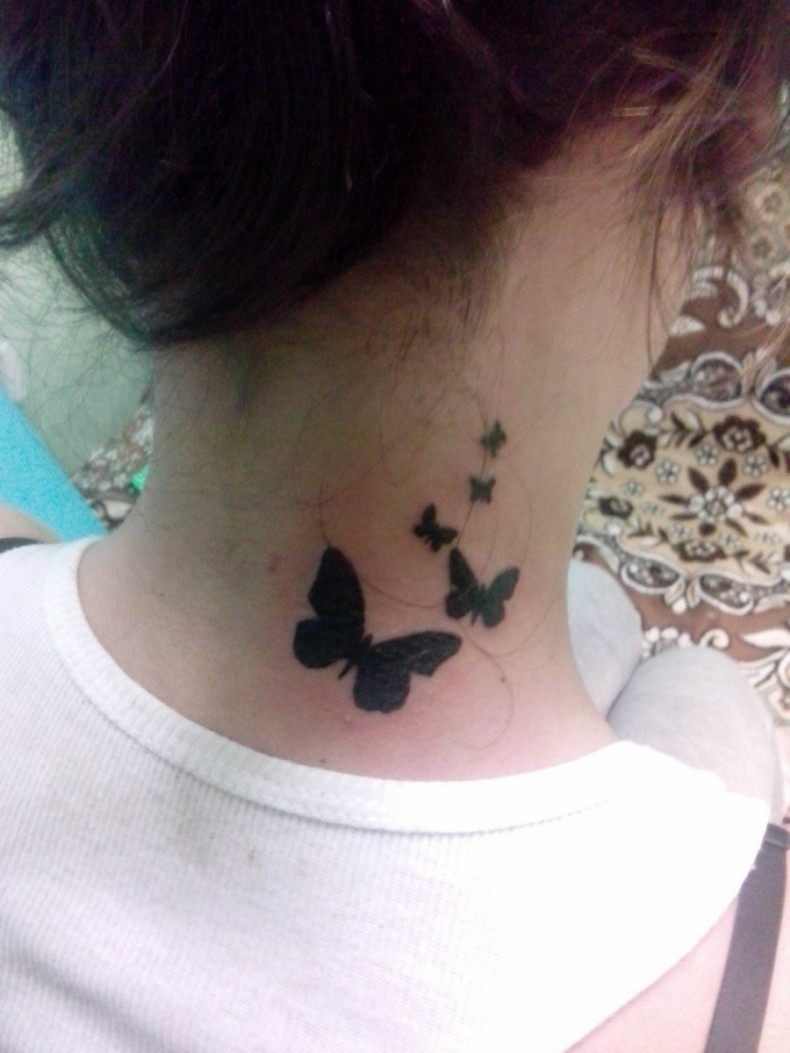 Butterfly tattoo on neck, photo - Tattoo Master Barb Tattoo