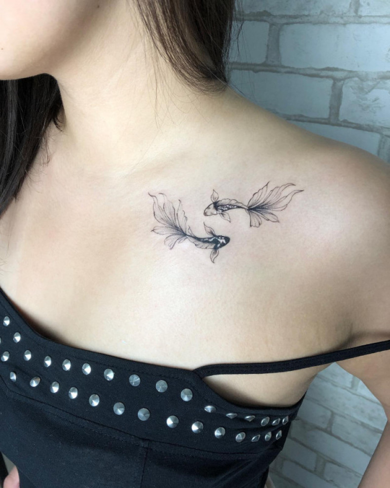 Women gold fish collarbone, photo - Tattoo Master Barb Tattoo