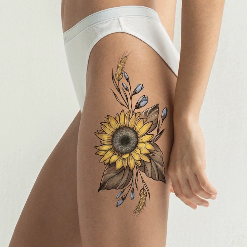 Women thigh sunflower, photo - Tattoo Master Barb Tattoo