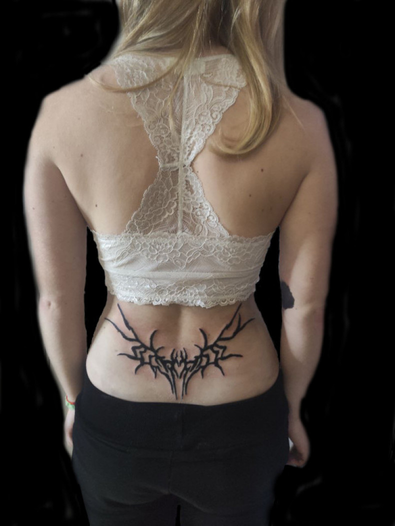 Women lower back, photo - Tattoo Master Barb Tattoo