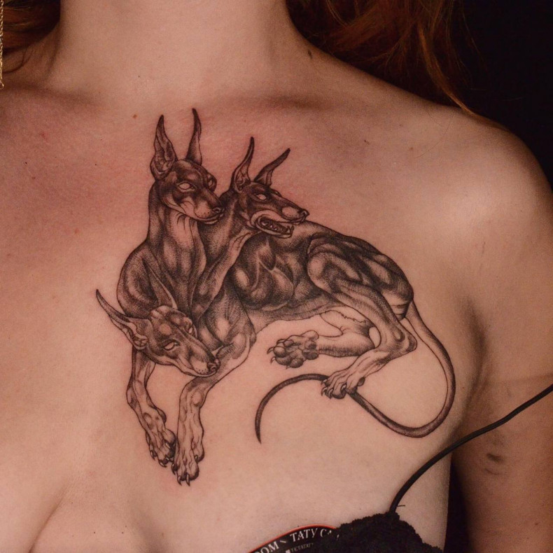 Women doberman chest, photo - Tattoo Master Barb Tattoo