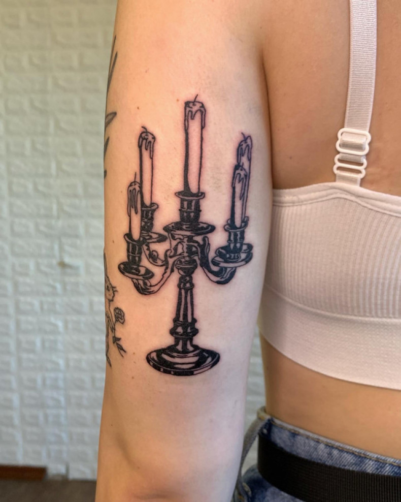 Women arm candle, photo - Tattoo Master Barb Tattoo