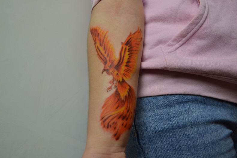 Arm watercolor firebird, photo - Tattoo Master Barb Tattoo