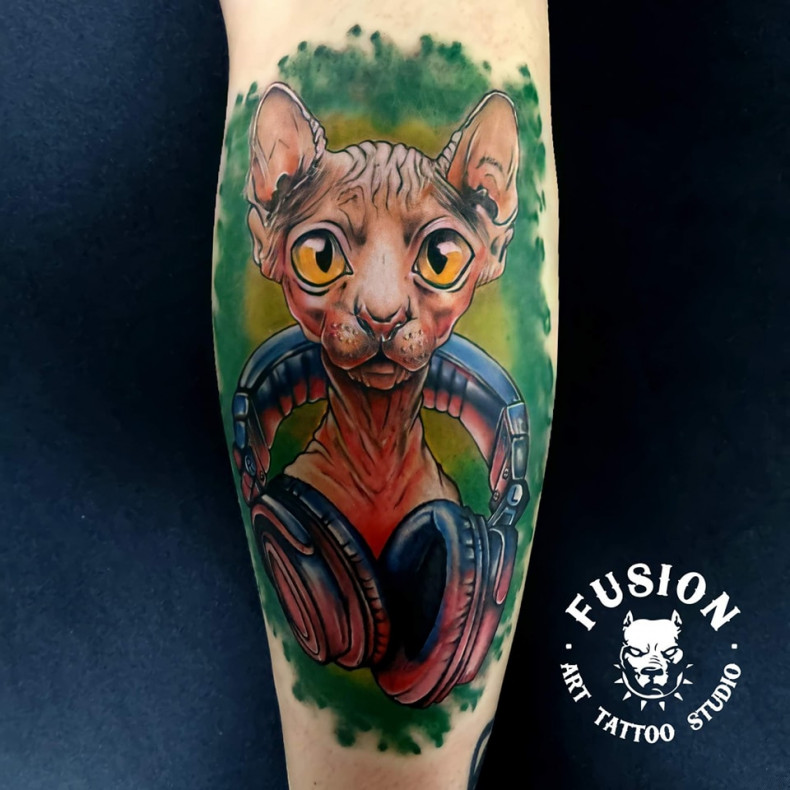 Watercolor cat tattoo by master Andrii Yudin, photo - Tattoo Master Barb Tattoo