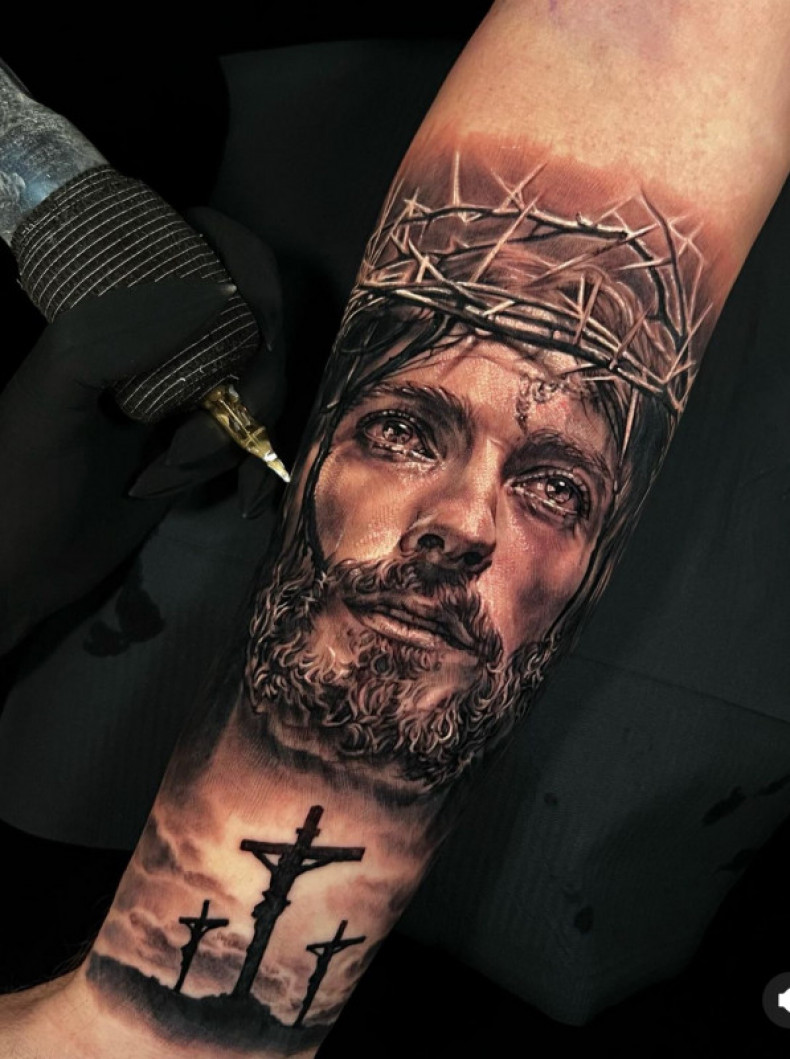 Arm Jesus cross, photo - Tattoo Master Barb Tattoo