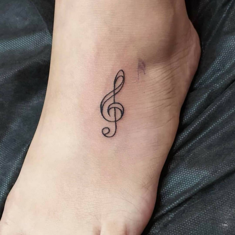 Leg foot music note, photo - Tattoo Master Barb Tattoo