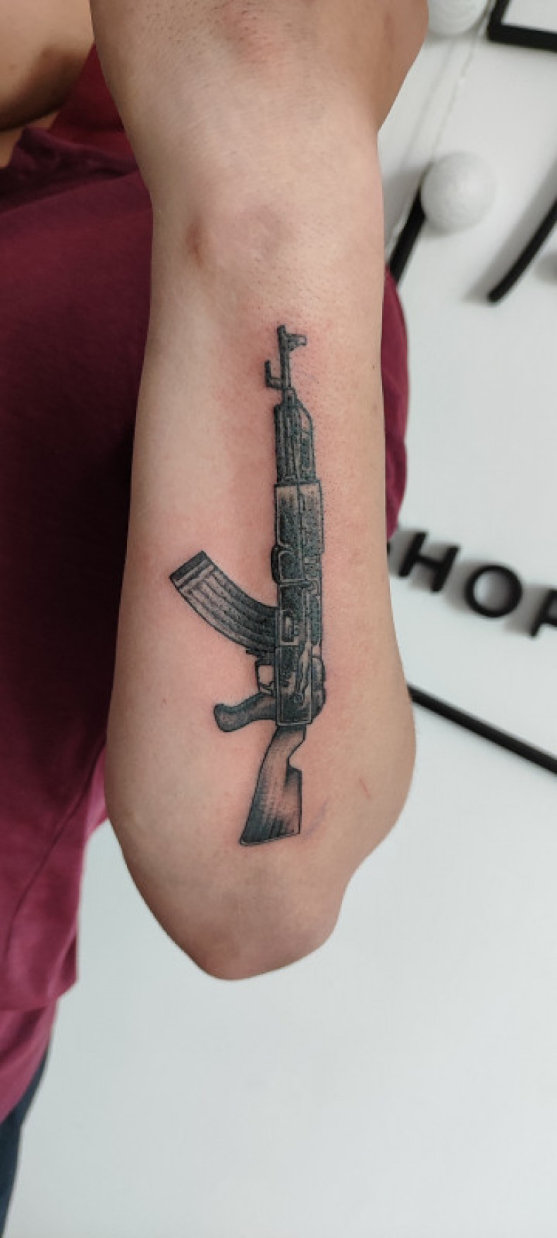 Rifle military forearm, photo - Tattoo Master Barb Tattoo