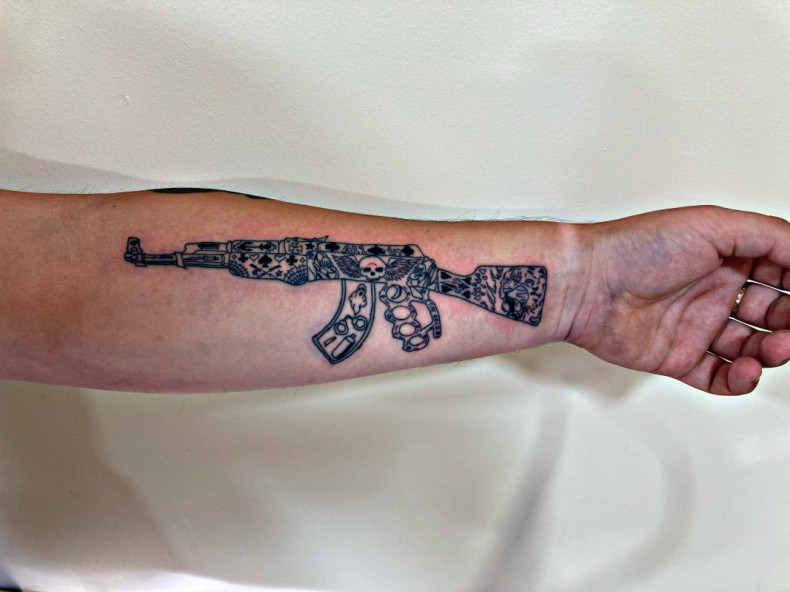 Rifle military forearm, photo - Tattoo Master Barb Tattoo