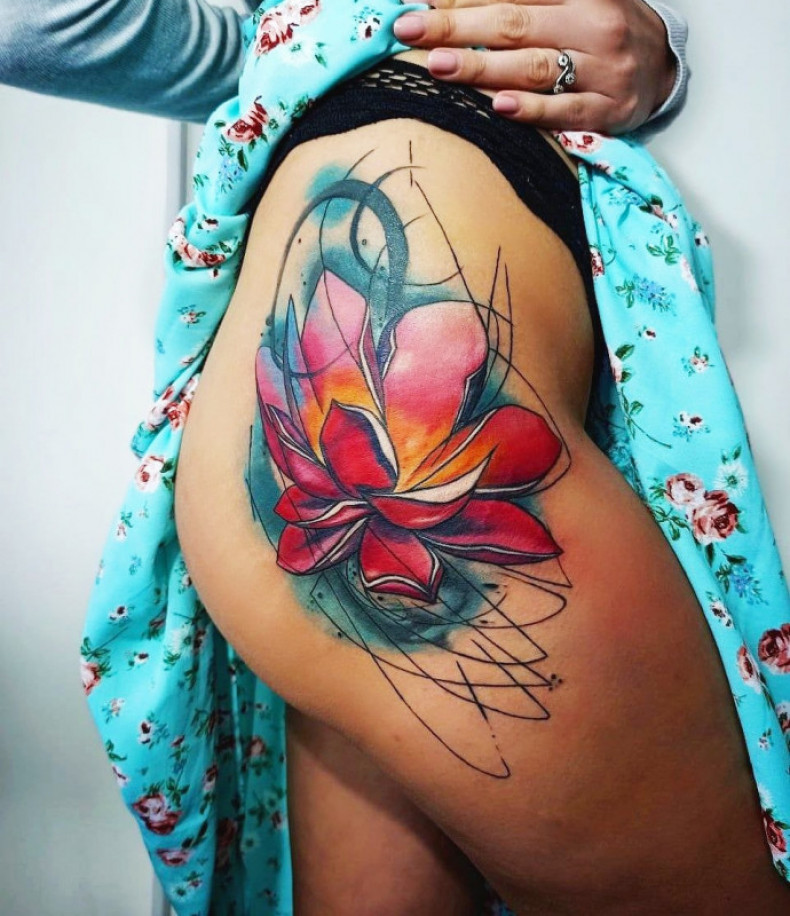 Lotus flower butt colorful, photo - Tattoo Master Barb Tattoo