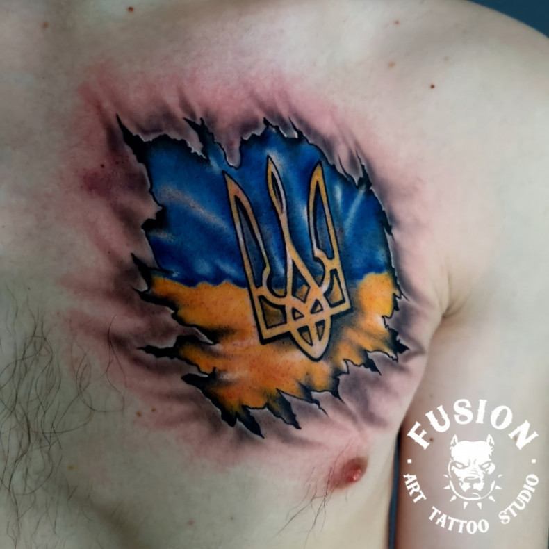 Ukrainian flag tattoo by master Andrii Yudin, photo - Tattoo Master Barb Tattoo