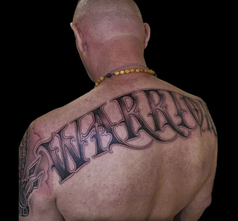 Warrior lettering back, photo - Tattoo Master Barb Tattoo