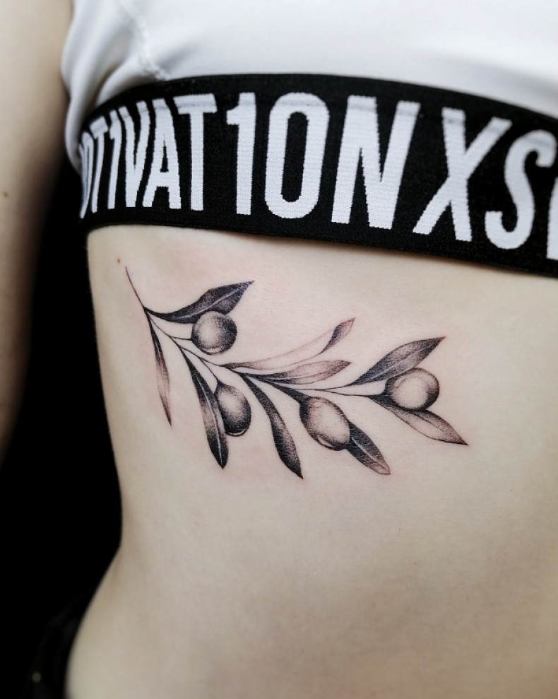 Branch olive under breast, photo - Tattoo Master Barb Tattoo