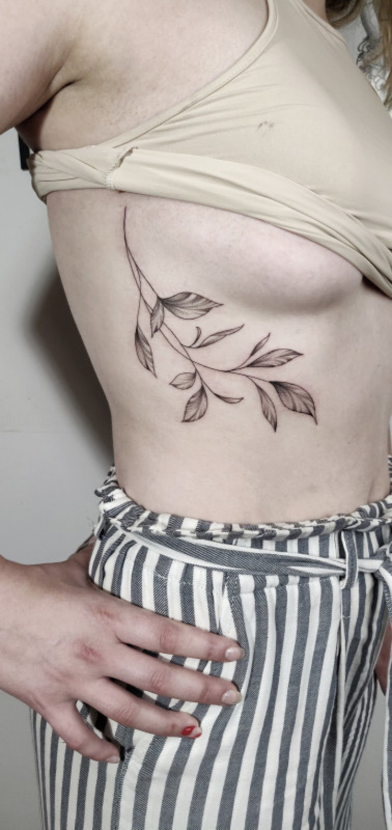 Twig branch under breast, photo - Tattoo Master Barb Tattoo