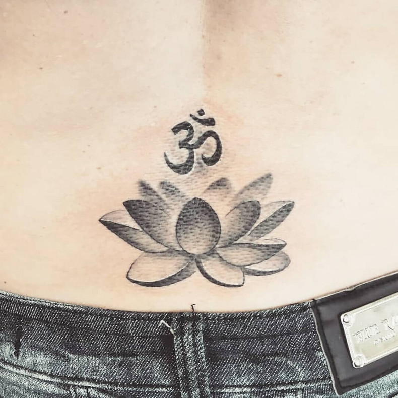 Lotus flower lower back om, photo - Tattoo Master Barb Tattoo