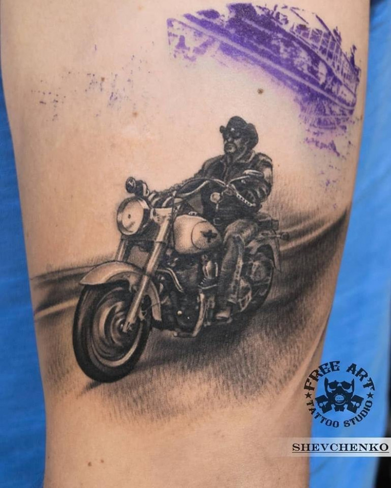 Black and grey motorcycle, photo - Tattoo Master Barb Tattoo