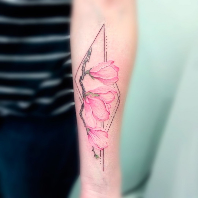 Colored magnolia tattoo, photo - Tattoo Master Barb Tattoo