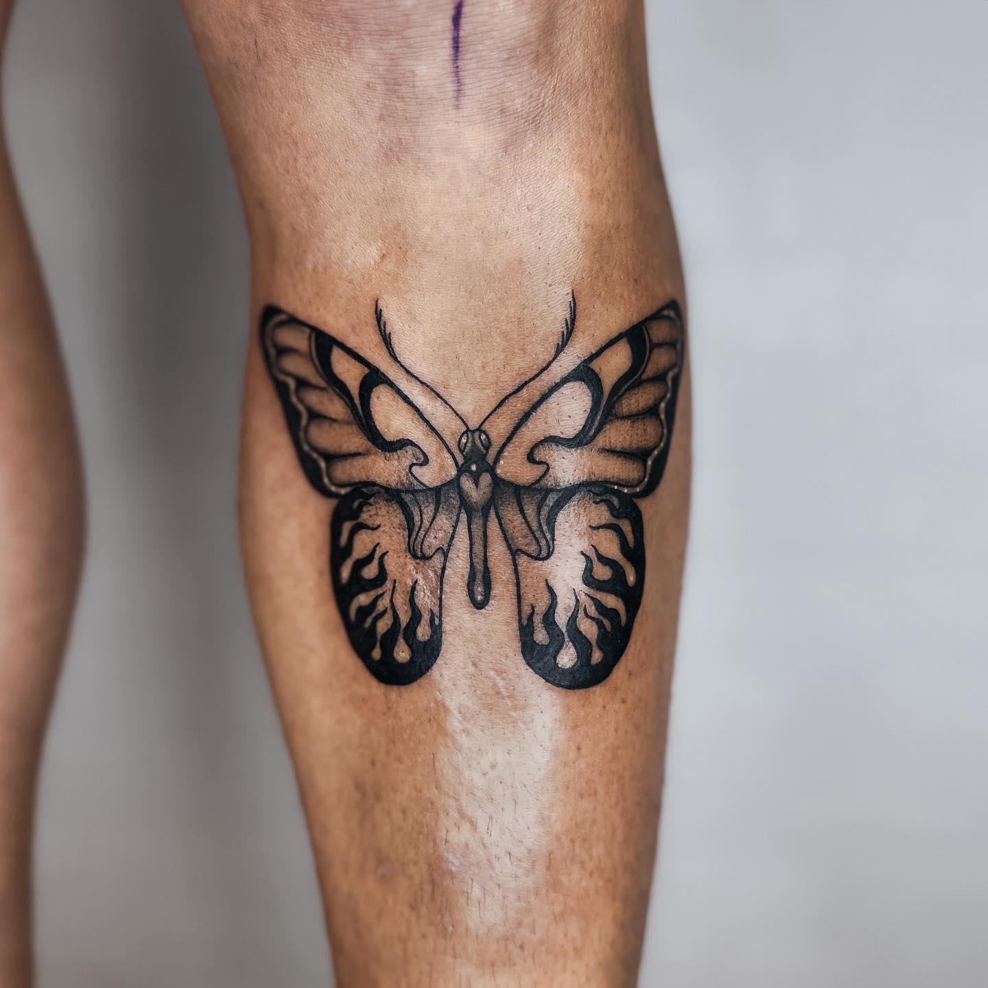 Butterfly tattoo men thigh