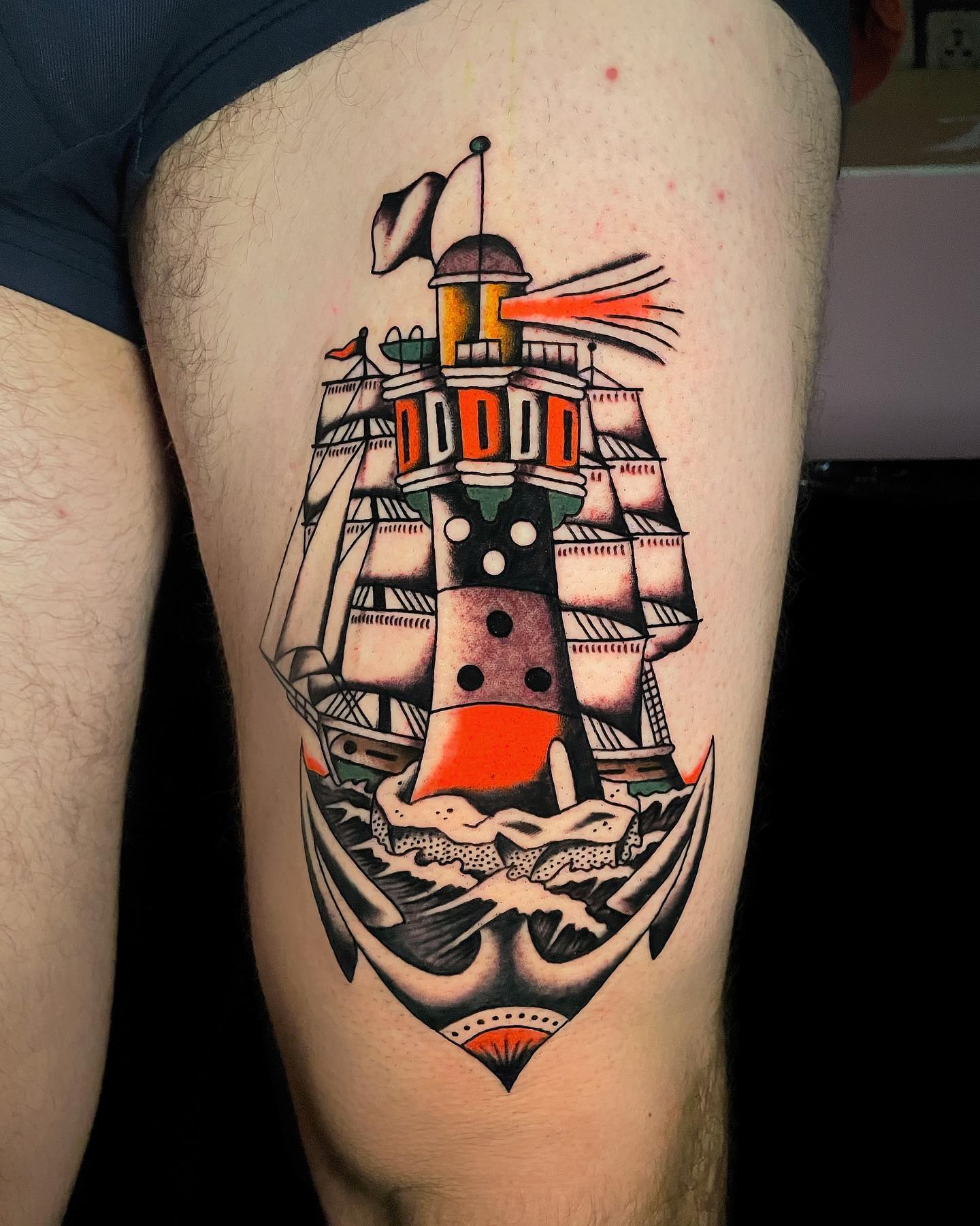 Traditional Ship and Lighthouse Tattoo