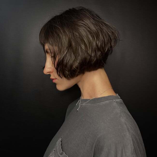 Shortened french bob with bangs in profile