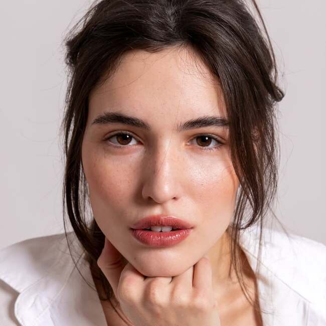 Nude makeup without heavy contouring, emphasizing natural skin texture
