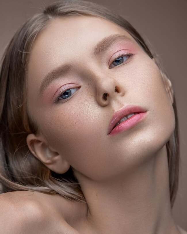 Nude makeup with pink eyeshadows and natural skin texture