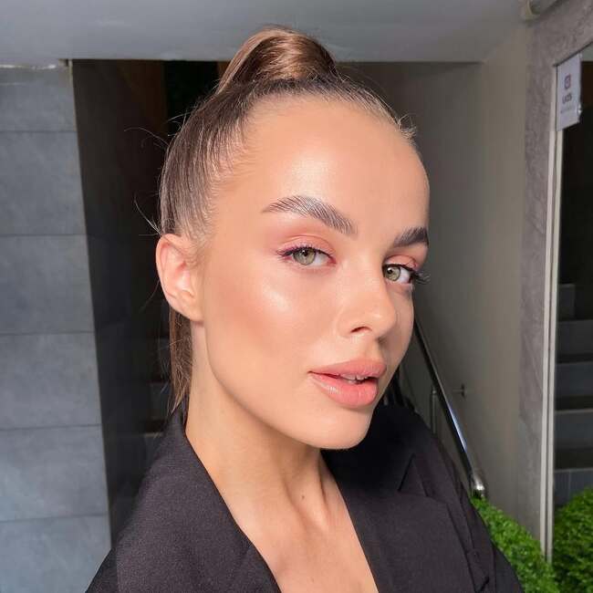 Minimalist nude makeup with radiant skin and natural flush