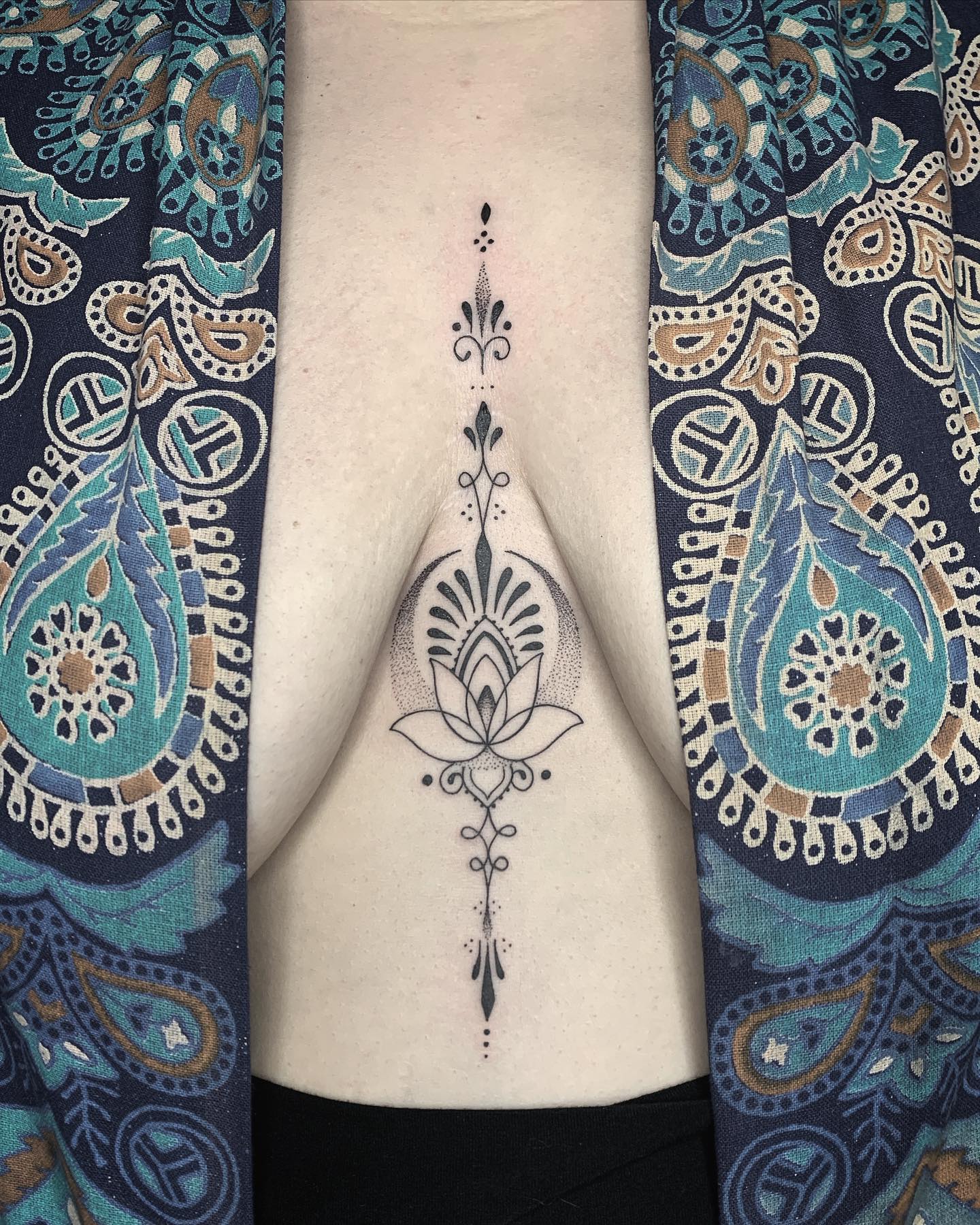 Unalome Lotus Sternum Tattoo