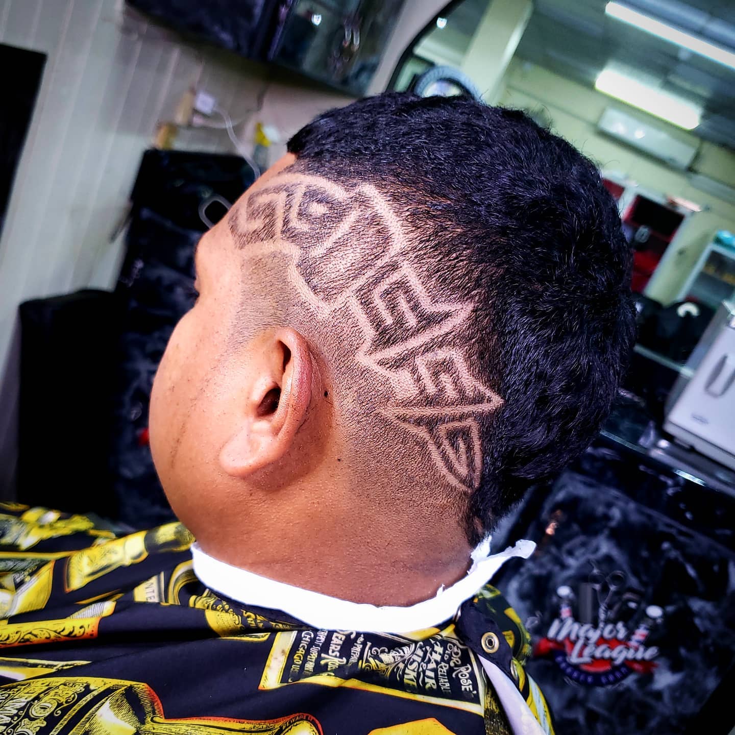 Mohawk Fade Cut with Hair Tattoo