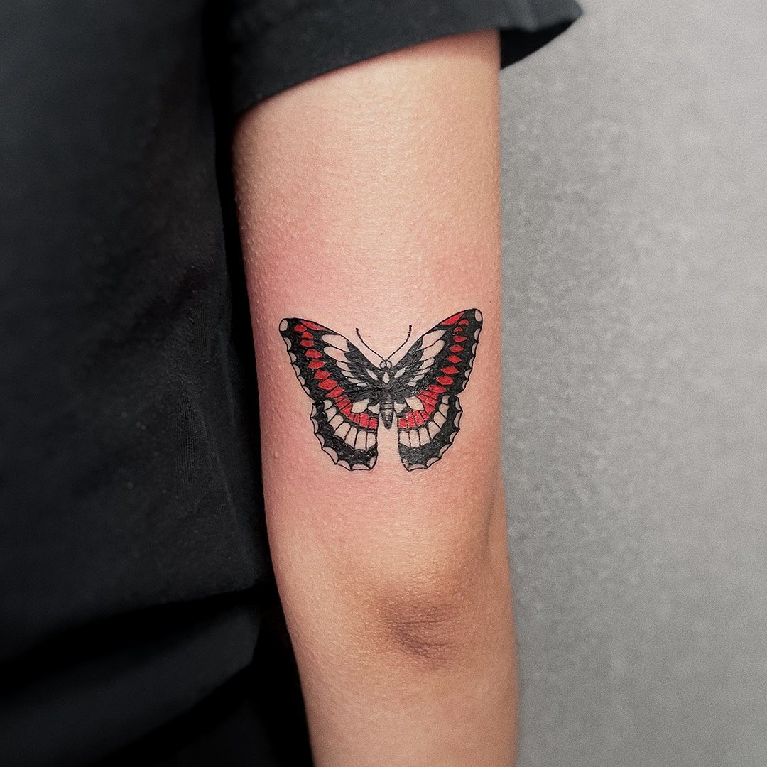 Red and black monarch tattoo