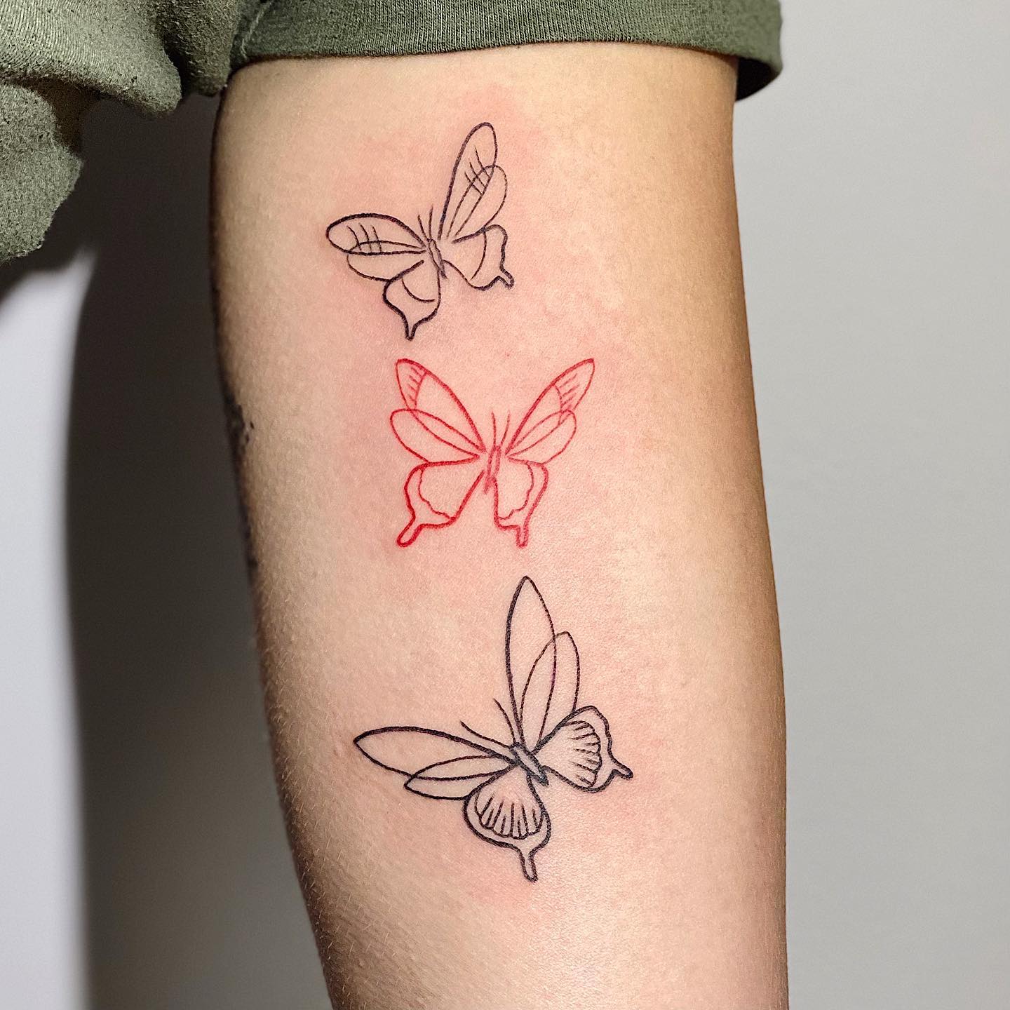Red Black butterfly thigh tattoos