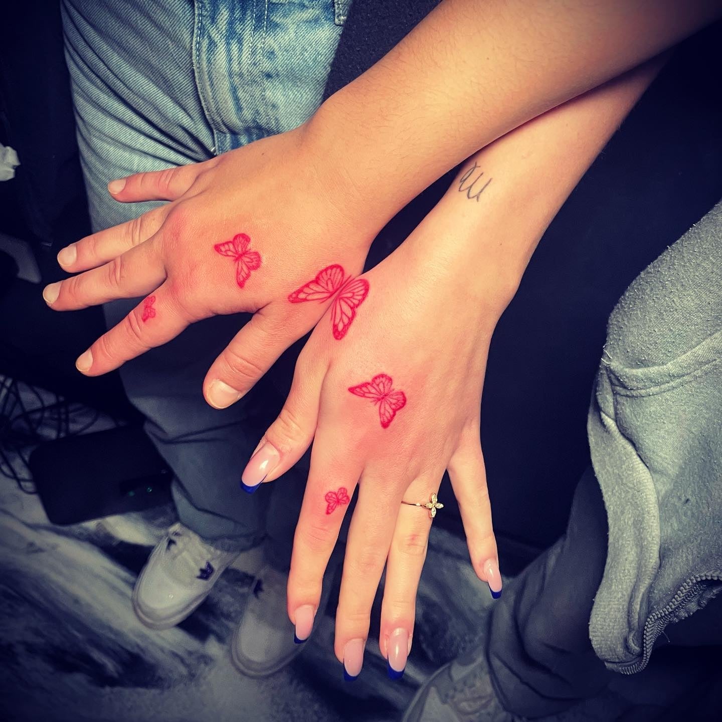 Matching Butterfly hand tattoo red