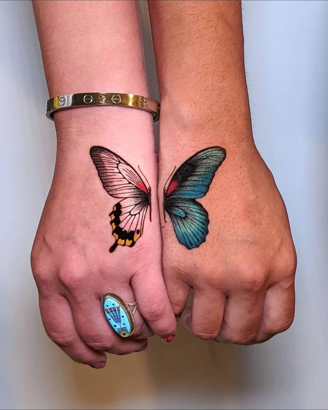 Half butterfly hand tattoo