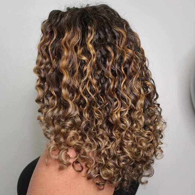 Honey balayage curly hair