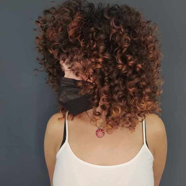 Copper red balayage curly hair