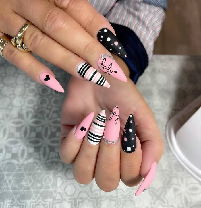 Close-Up Photo of Black And Light Pink Matte Manicure