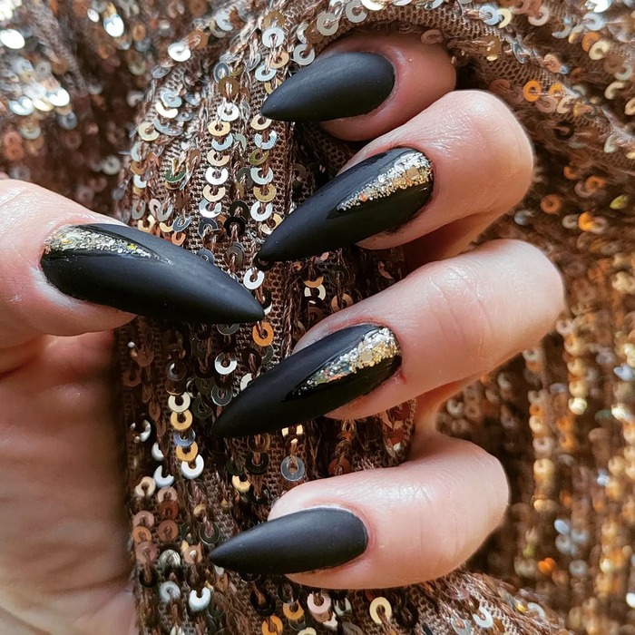 Black And Gold Matte Almond Nails Close-Up Image 
