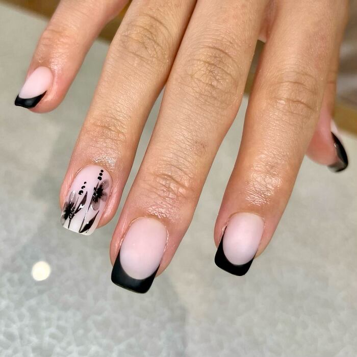 Close-Up Photo of Neutral Matte Nails with Black French Tips