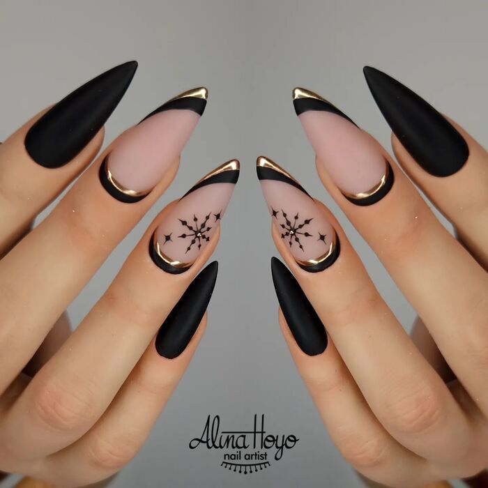 Close-Up Photo of Black And Gold Matte Almond Nails