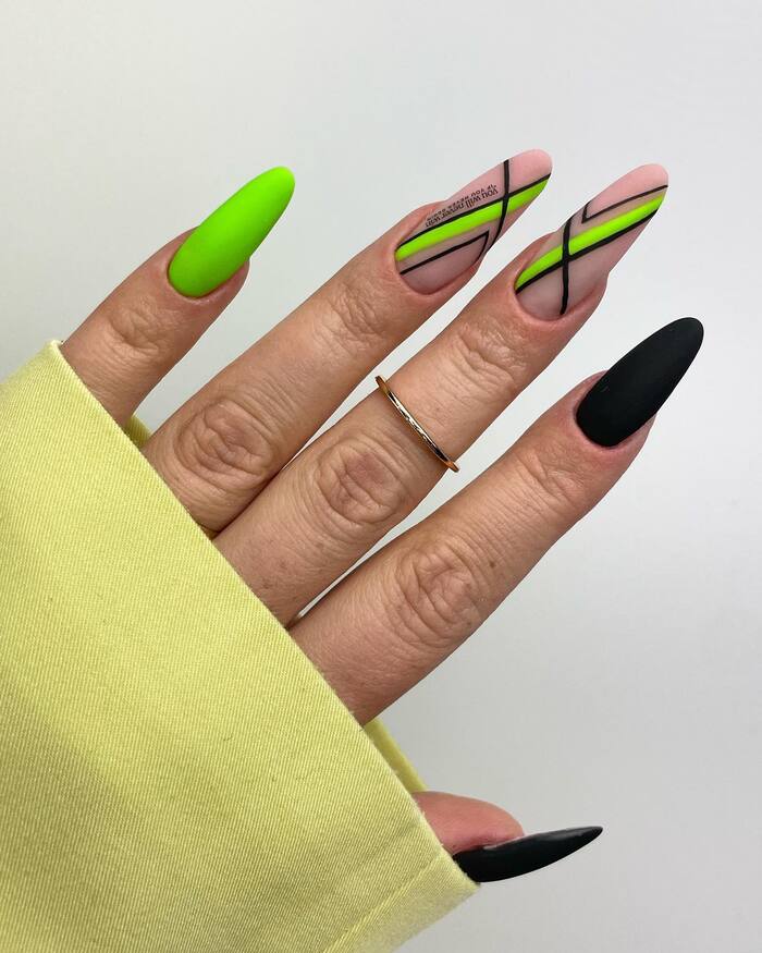 Black And Neon Green Almond Nails Close-Up Image 