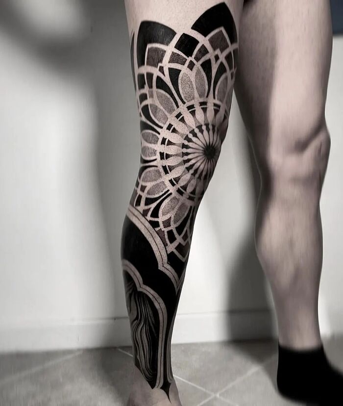 Blackout mandala tattoo on leg